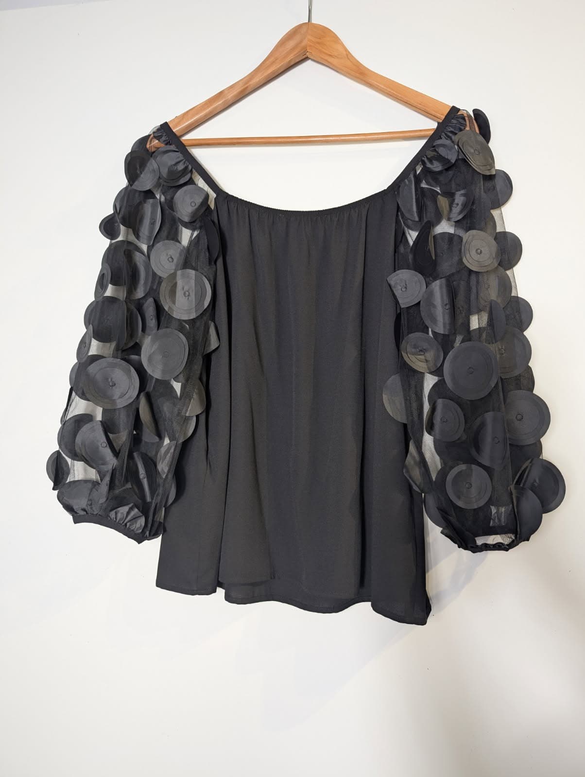 Joseph Ribkoff Black Mesh Sleeve Blouse with Circular Appliqué — photo 7 of 7