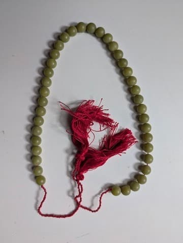 Traditional Green Bead Prayer Mala With Red Silk Tassels — photo 1 of 6