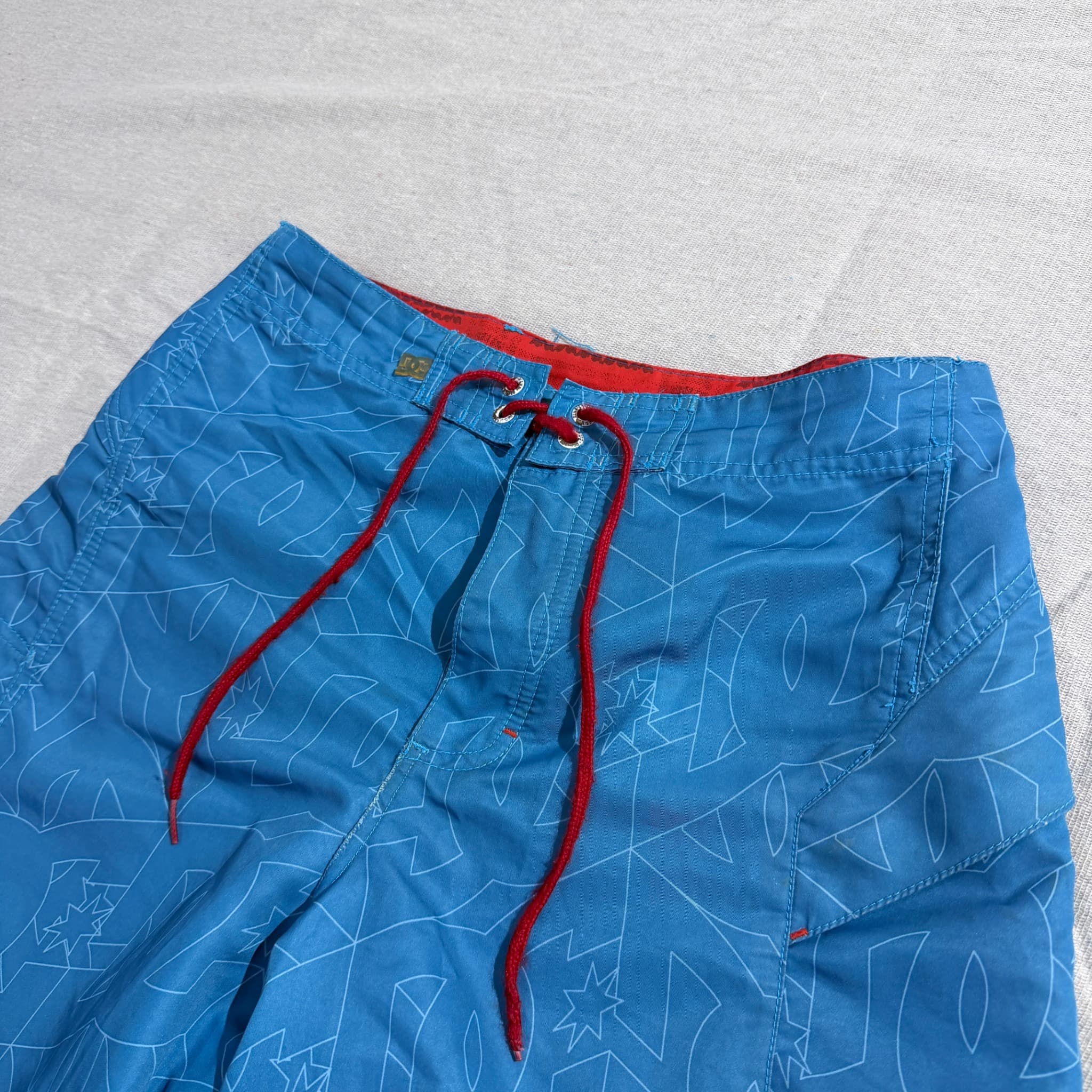 DC Men's Blue All-Over Logo Print Board Shorts — photo 2 of 9