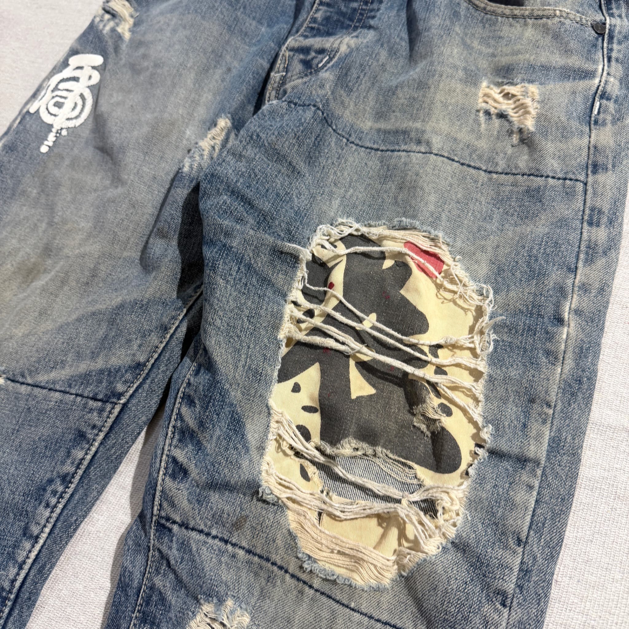 HUSENJI Distressed Denim Jeans With Kanji Print And Camo Patchwork — photo 6 of 10