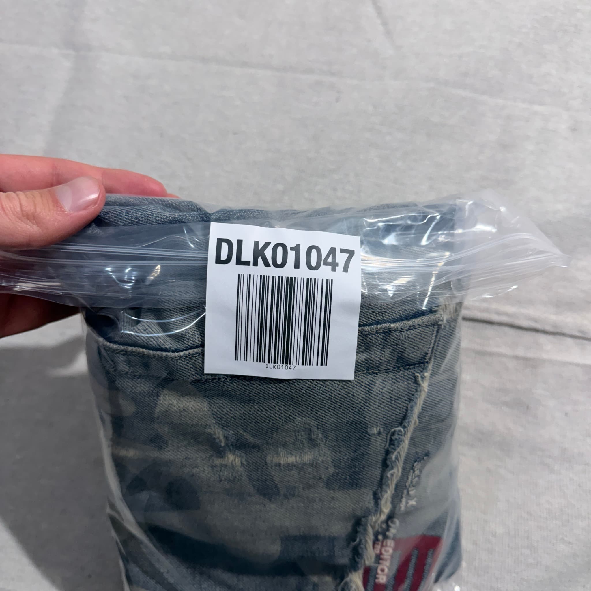 HUSENJI Distressed Denim Jeans With Kanji Print And Camo Patchwork — photo 10 of 10