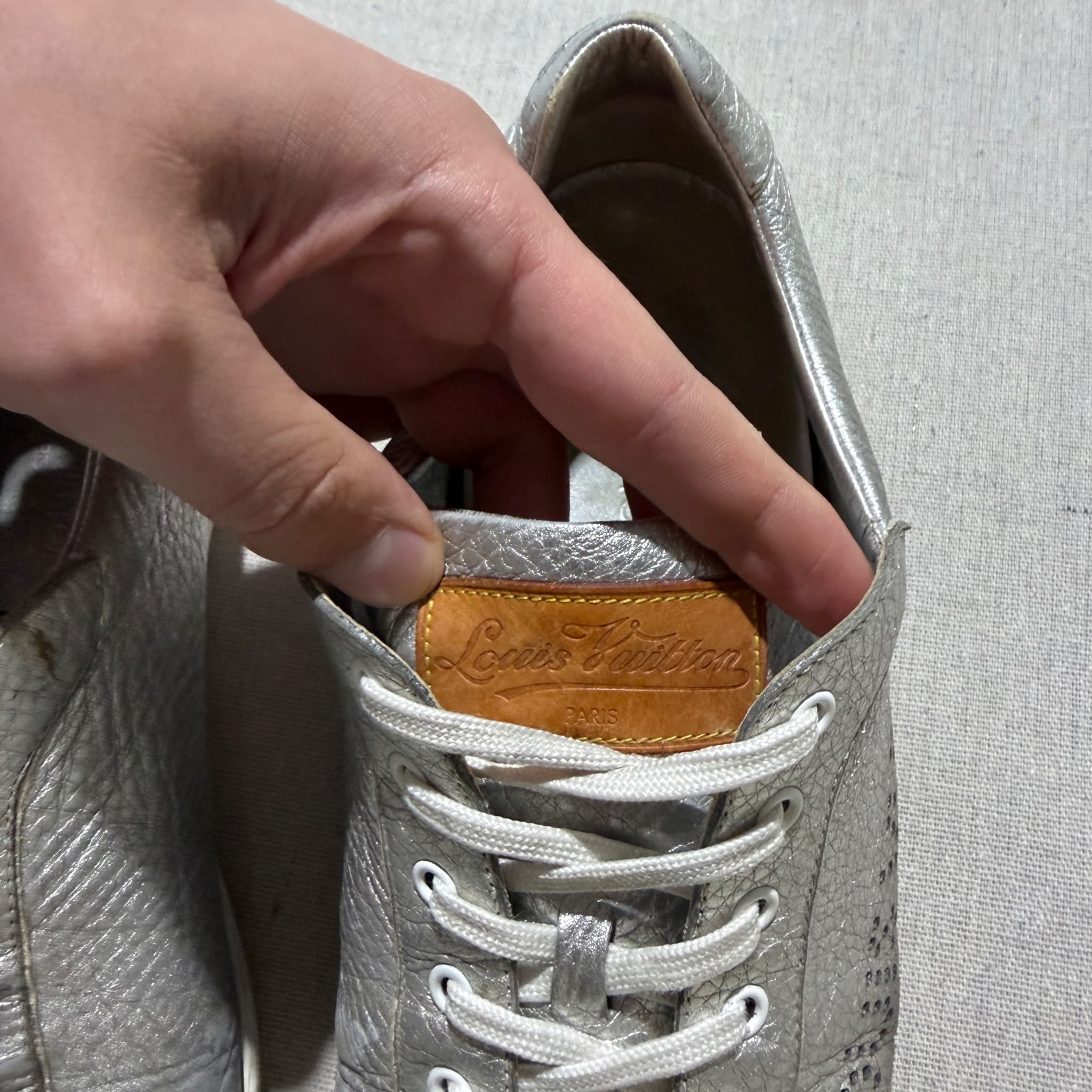 Louis Vuitton Silver Metallic Leather Perforated Logo Sneakers — photo 3 of 8