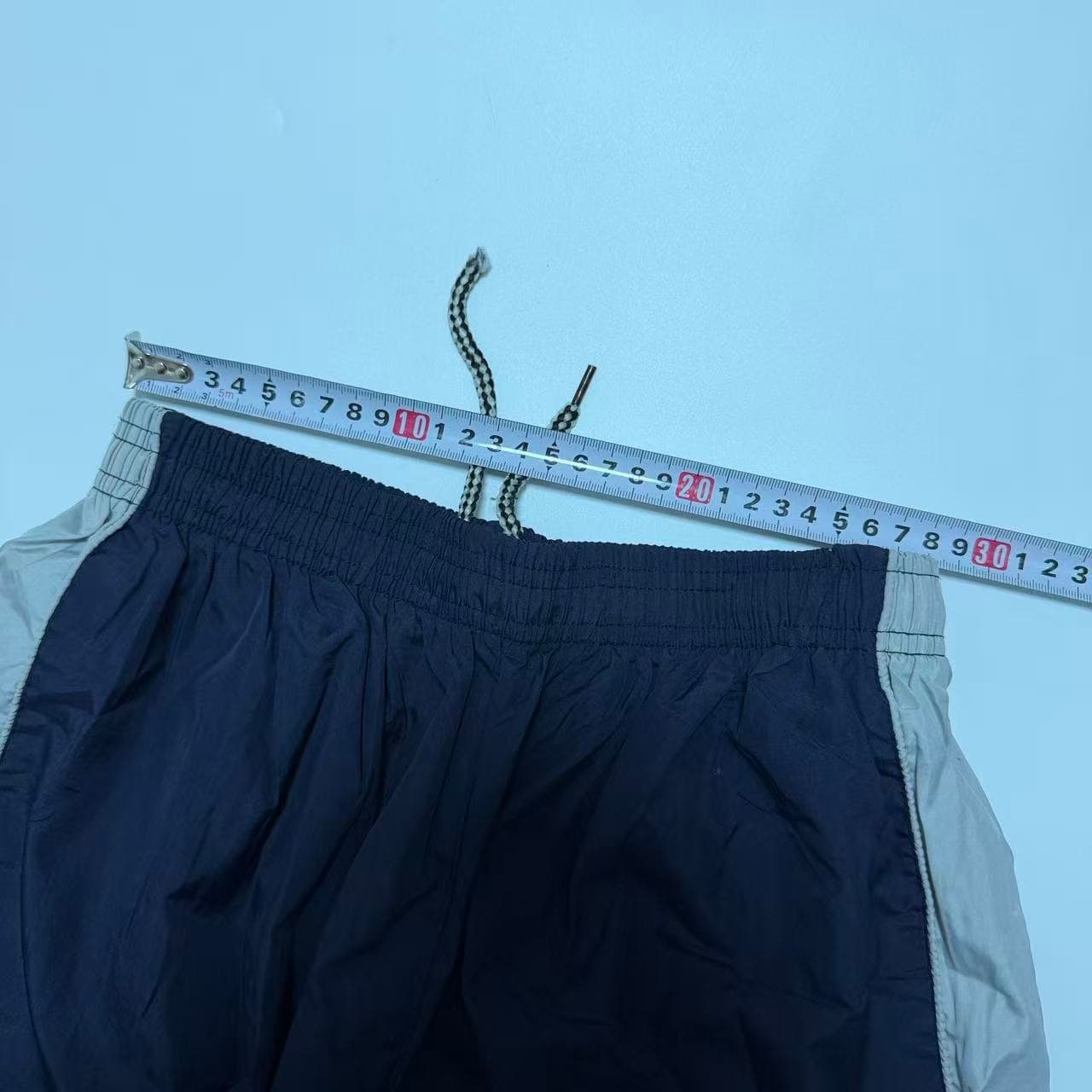 Vintage 90s Nike Swoosh Nylon Track Pants — photo 3 of 12