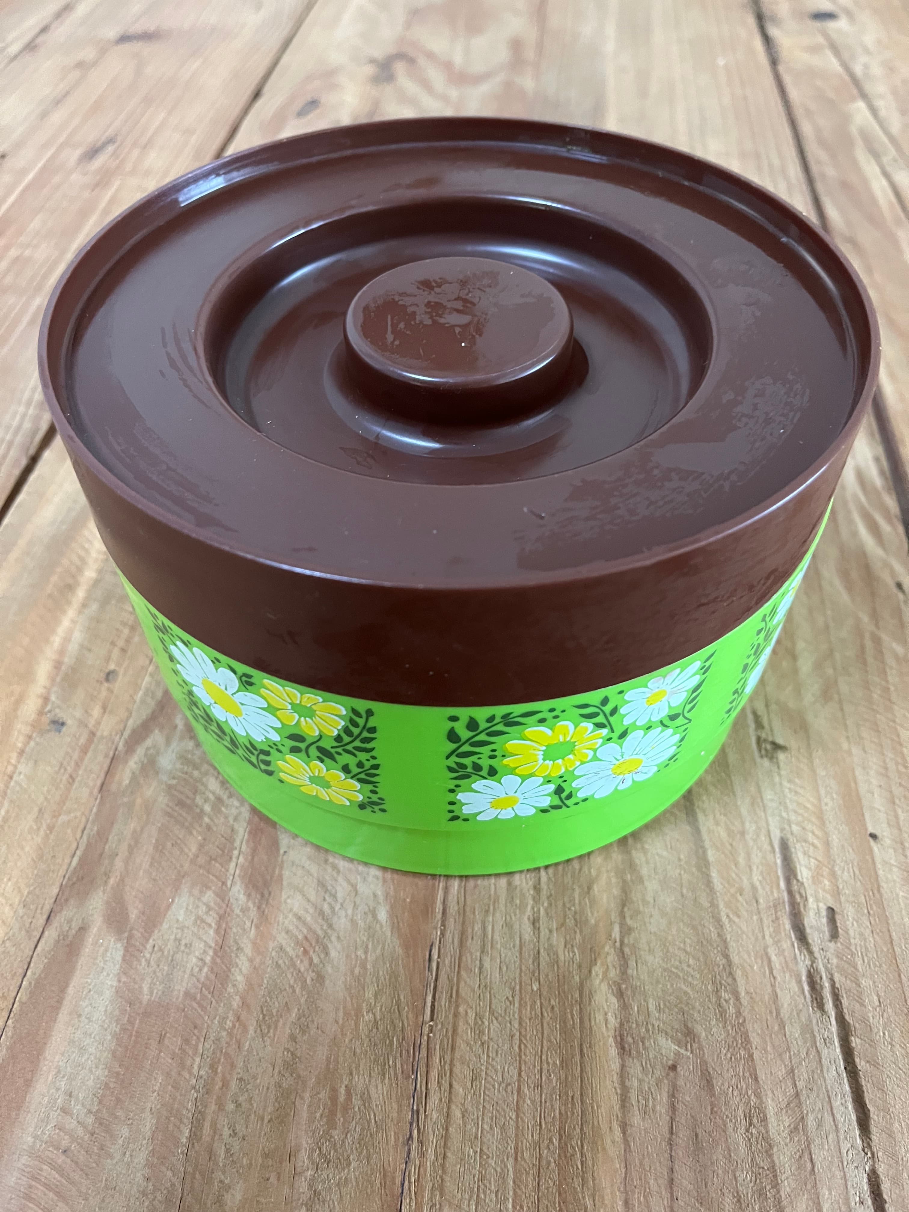 1970s Retro Green, Daisy and Brown Floral Vintage Plastic Kitchen Cannister — photo 1 of 6