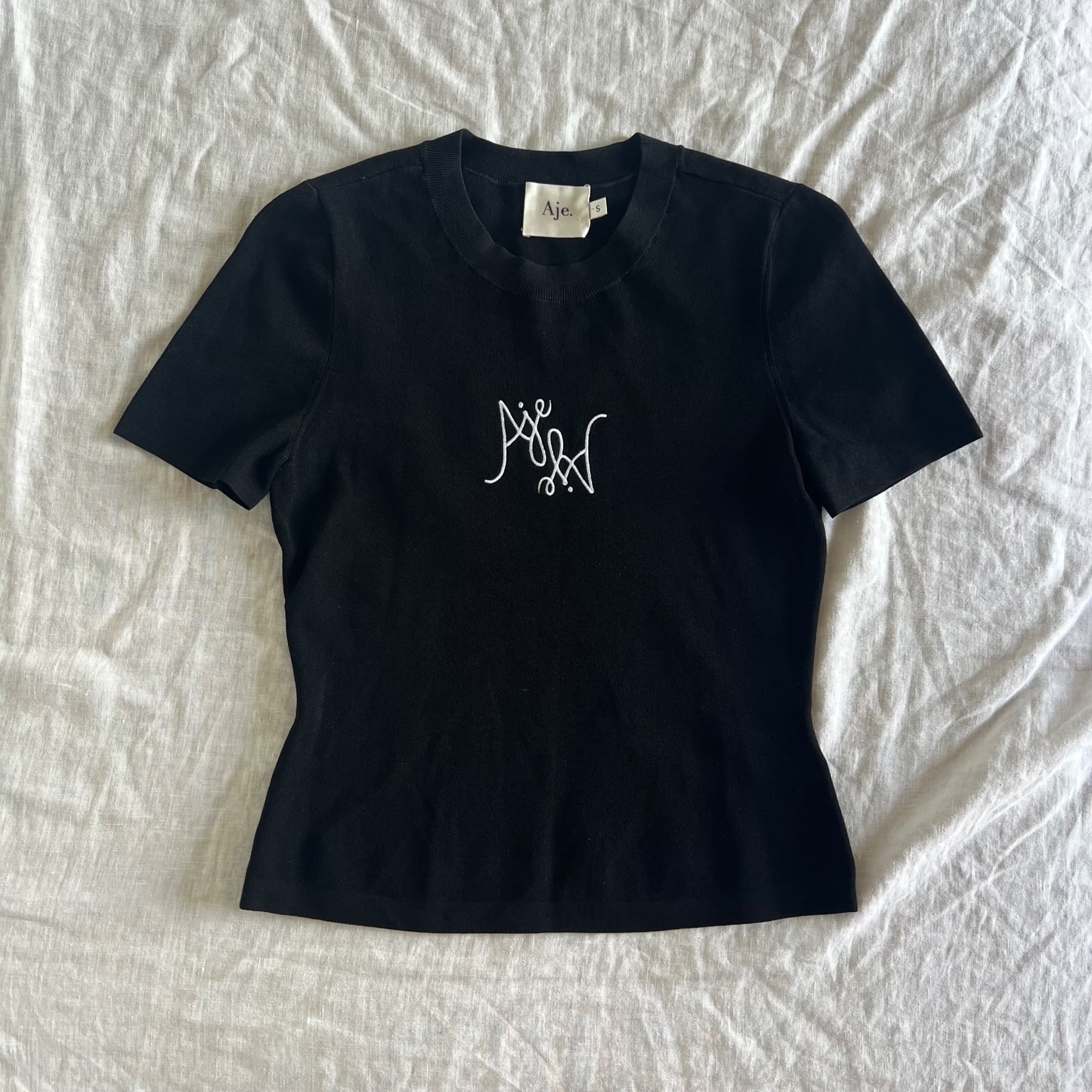 Aje Prophecy Knit Logo Baby Tee in Black (Size S) — photo 1 of 10