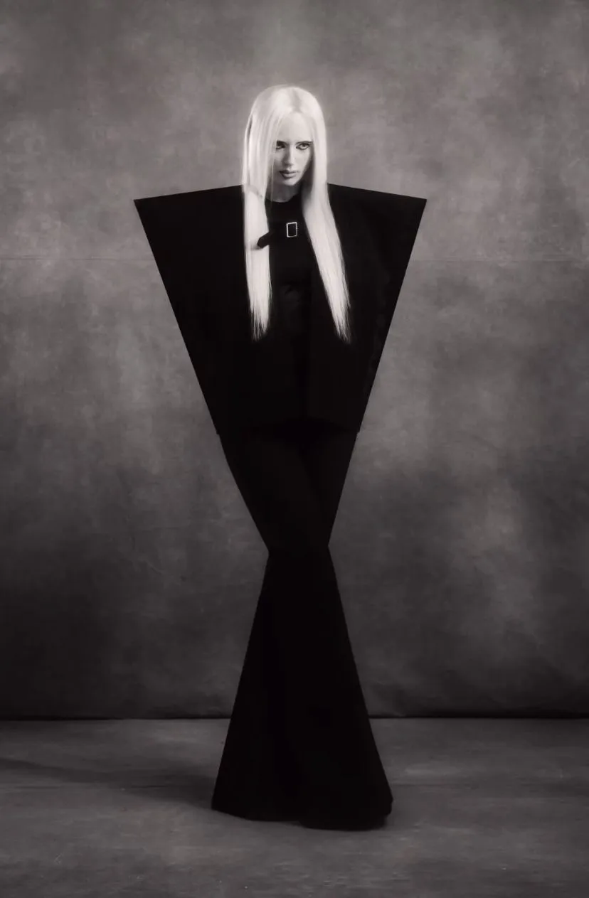 Avant Garde aesthetic — The extreme geometric silhouette, monochromatic palette, and stark presentation are a perfect embodiment of Avant Garde principles, strongly evoking designers like Rick Owens and Maison Margiela.