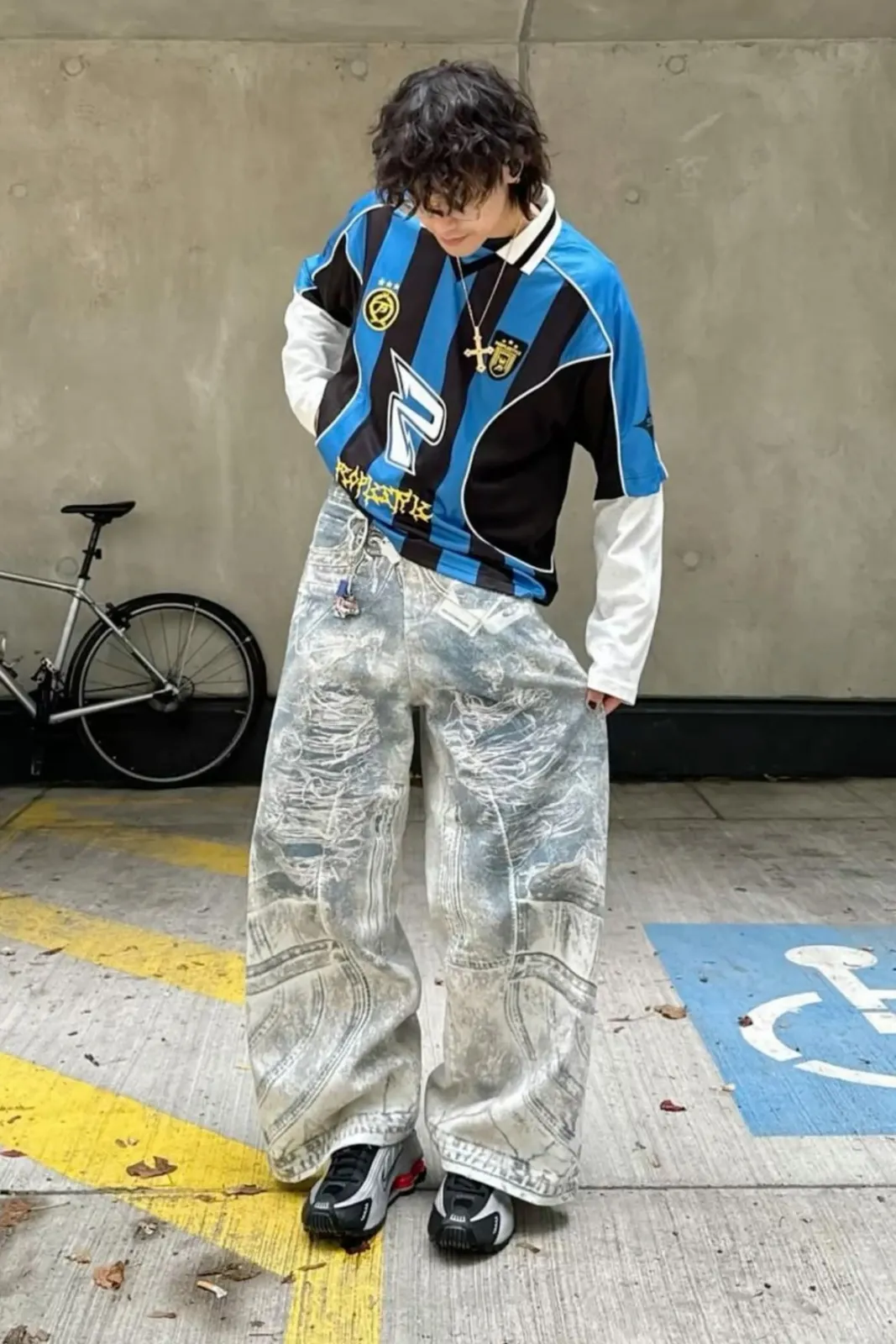 Blokecore aesthetic — Vintage football shirt, baggy distressed jeans, and Adidas sneakers perfectly embody the 90s terrace fashion and casual hooligan reference.