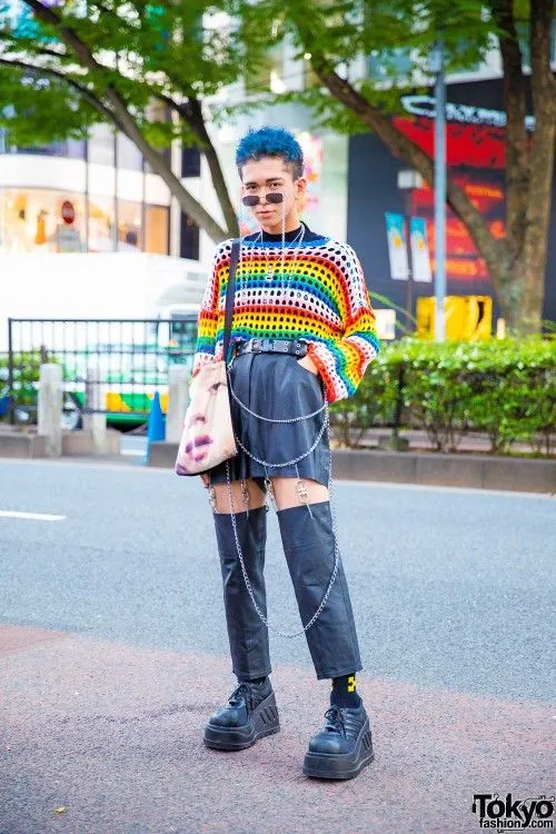 Genderless Kei aesthetic — The bright rainbow crochet top, leather shorts with chain details, and platform shoes are highly representative of the vibrant, gender-bending streetwear described.
