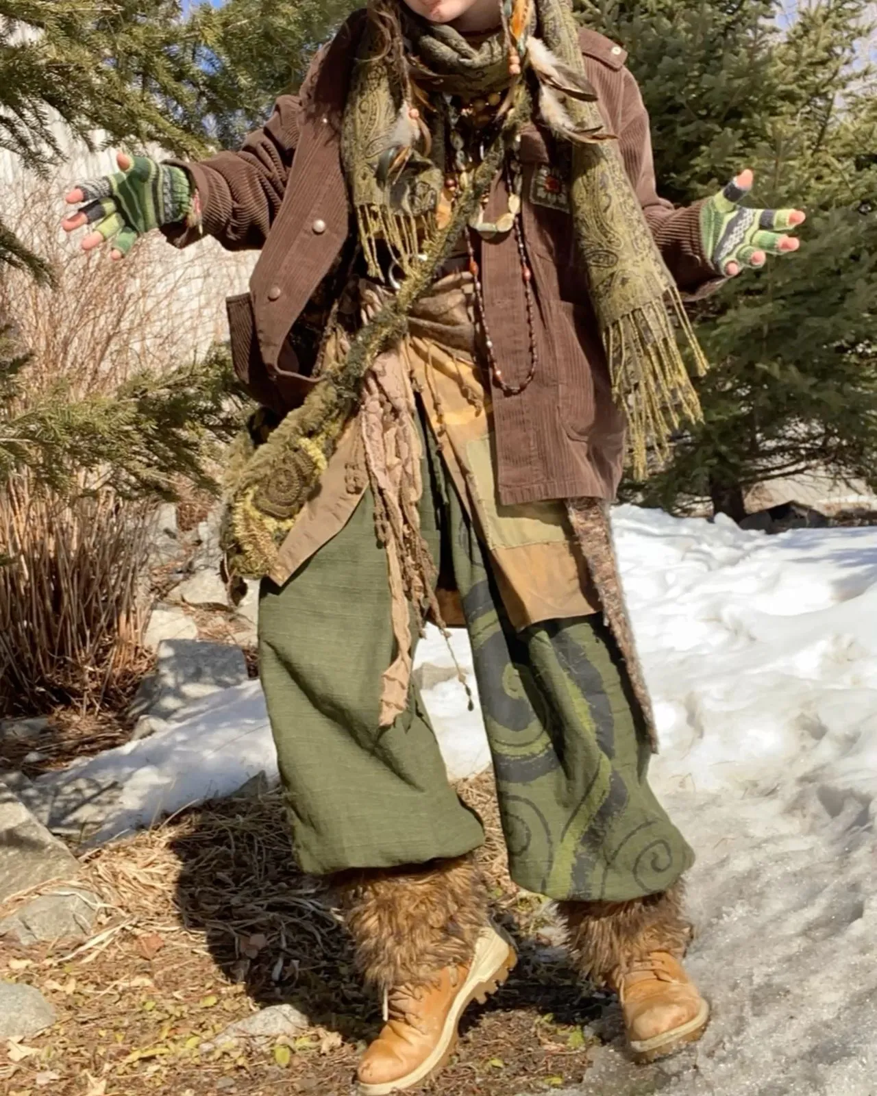 Goblincore aesthetic — The layered, earth-toned, and textured outfit with corduroy, knits, and fuzzy elements strongly evokes the 'lived-in' and 'earthy' description, including the visual signature of mismatched socks and scuffed boots.