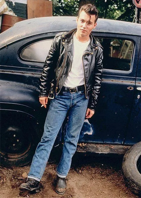 Greaser aesthetic — Iconic Greaser look with slicked hair, leather perfecto, white tee, cuffed Levi's, and engineer boots, embodying the 'Wild One' aesthetic.