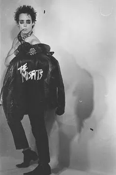 Horror Punk aesthetic — This image directly references Glenn Danzig and the Misfits with the iconic skull logo on the jacket and the overall punk aesthetic.