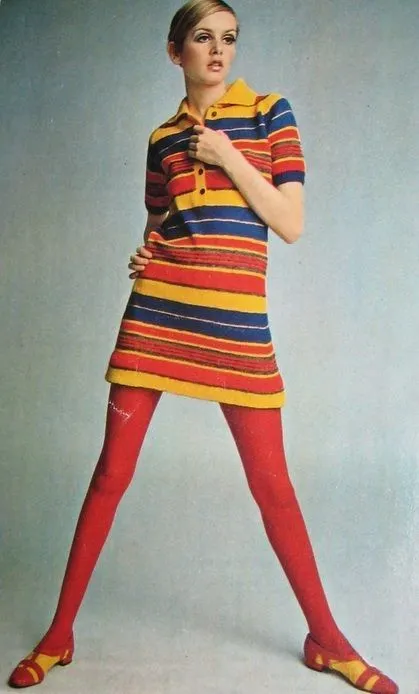Mod aesthetic — This image perfectly captures the Mod aesthetic with Twiggy-like model, a colorful striped shift dress, and red tights, directly referencing the era's iconic style and palette.