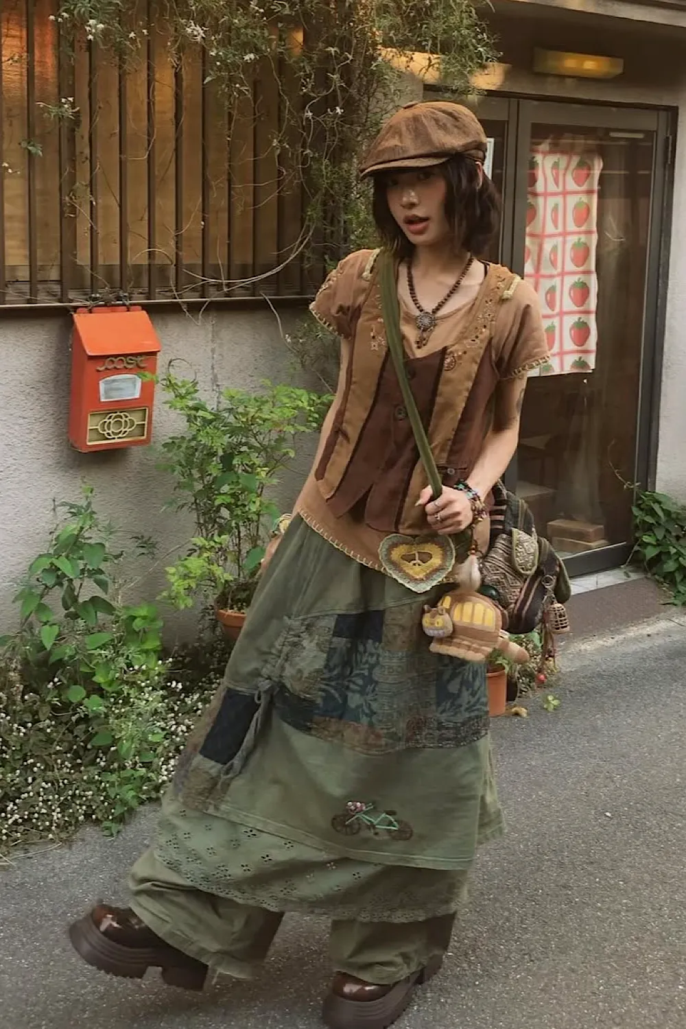 Mori Kei aesthetic — The patchwork skirt, layered earth-tone tops, and rustic accessories are highly representative of Mori Kei's natural and layered style.