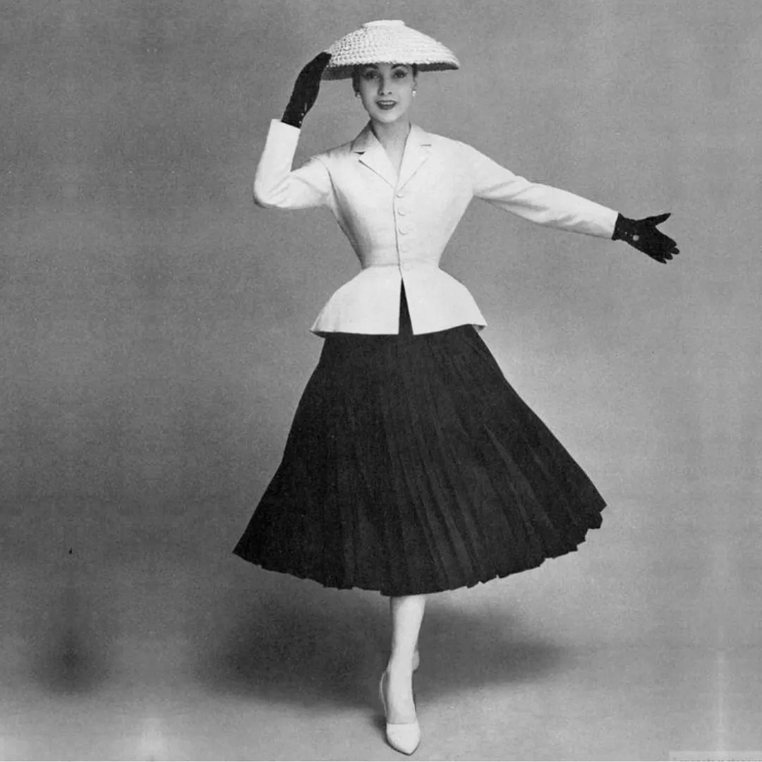 New Look aesthetic — Perfect representation of the Dior New Look with a Bar suit, nipped waist, full skirt, and period accessories.