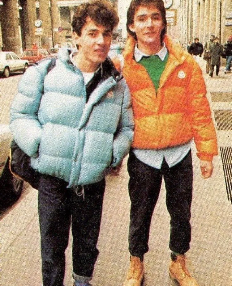 Paninaro aesthetic — Primary colored Moncler puffers and Timberland boots are iconic Paninaro elements.