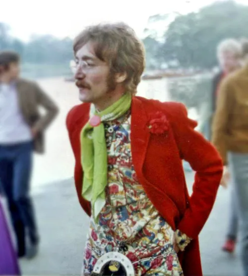 Peacock Revolution aesthetic — The red jacket, floral shirt, cravat, and decorative belt are all iconic elements of the Peacock Revolution, as is the wearer's persona.