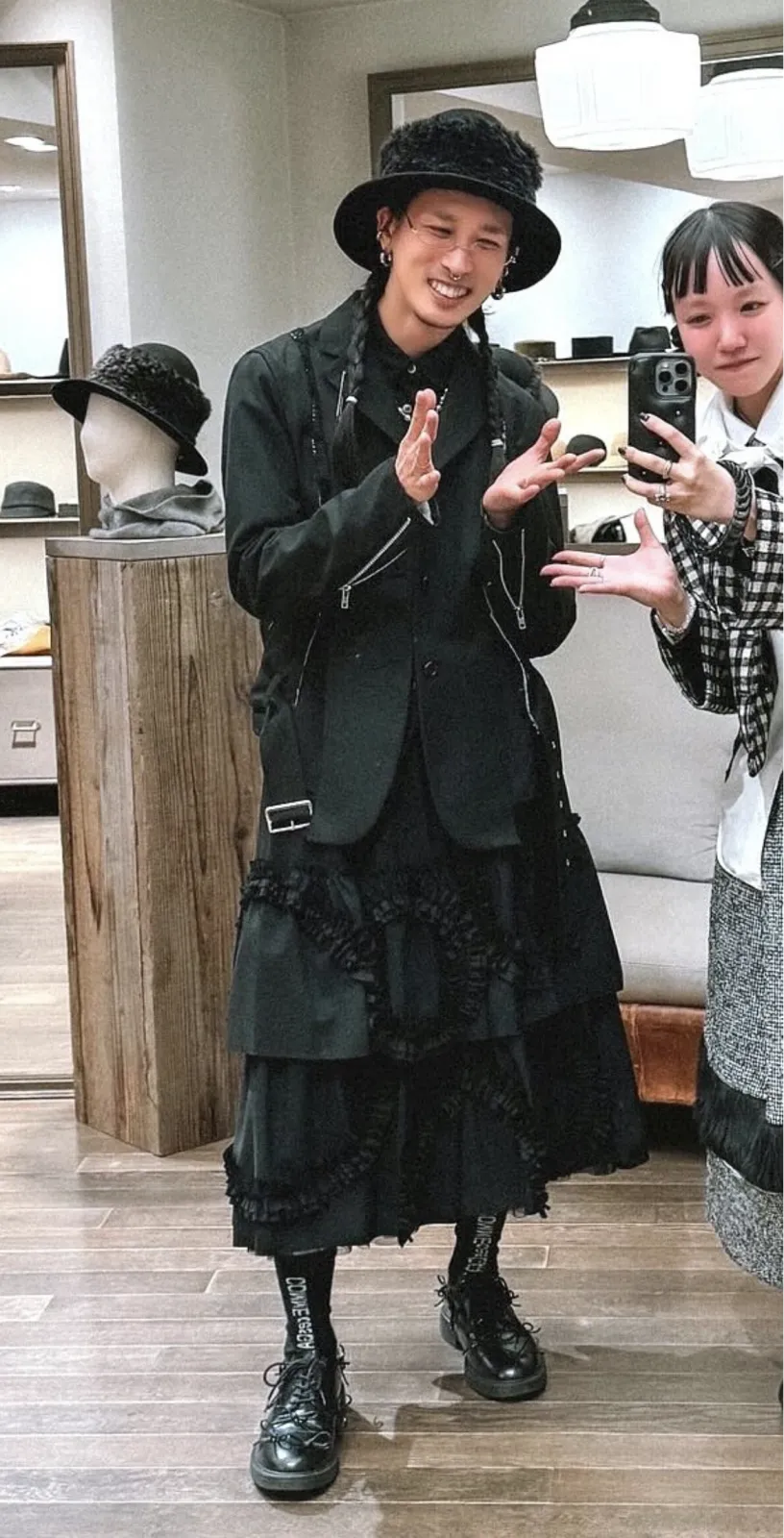 Salon Kei aesthetic — The sharp black tailoring, ruffled skirt, and dramatic styled hair strongly align with the description of Salon Kei, particularly the host-club menswear influence and polished yet edgy presentation.