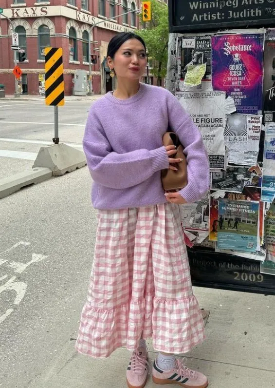 Spring Aesthetic aesthetic — The lavender sweater and pink gingham skirt, along with the overall fresh and feminine vibe, strongly align with the Spring Aesthetic's pastel palette and floral/gingham prints.