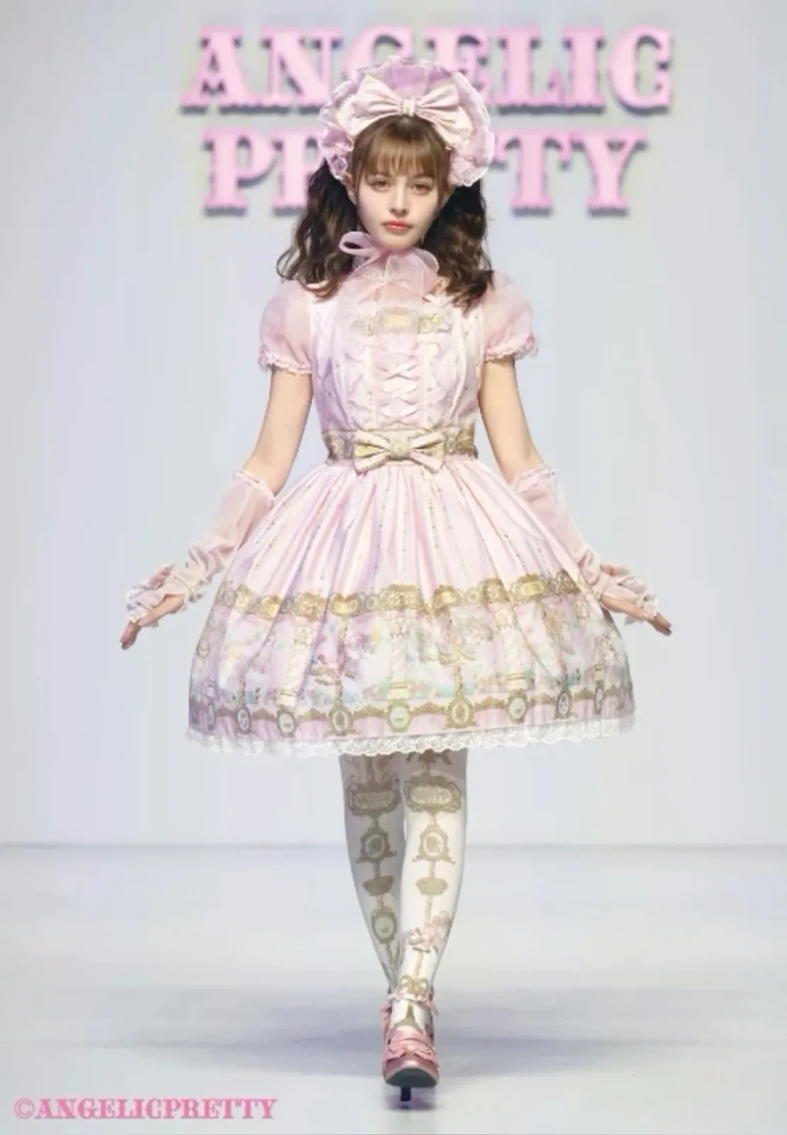 Sweet Lolita aesthetic — This image is a direct representation of Angelic Pretty, a canonical brand, showcasing the signature pastel pink, elaborate prints, and silhouette of Sweet Lolita.