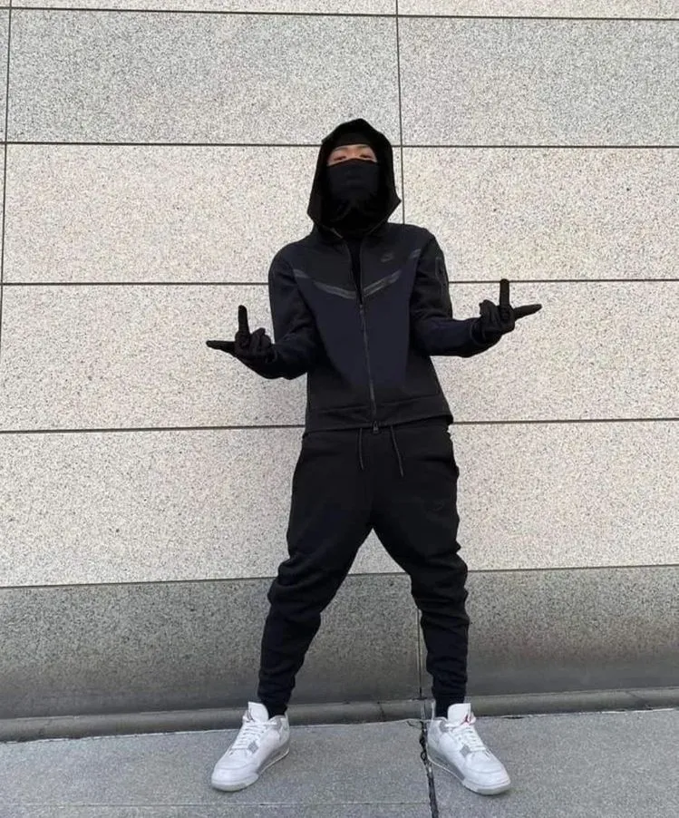 UK Drill aesthetic — The full Nike Tech Fleece tracksuit and balaclava are canonical elements of the UK drill aesthetic as described.