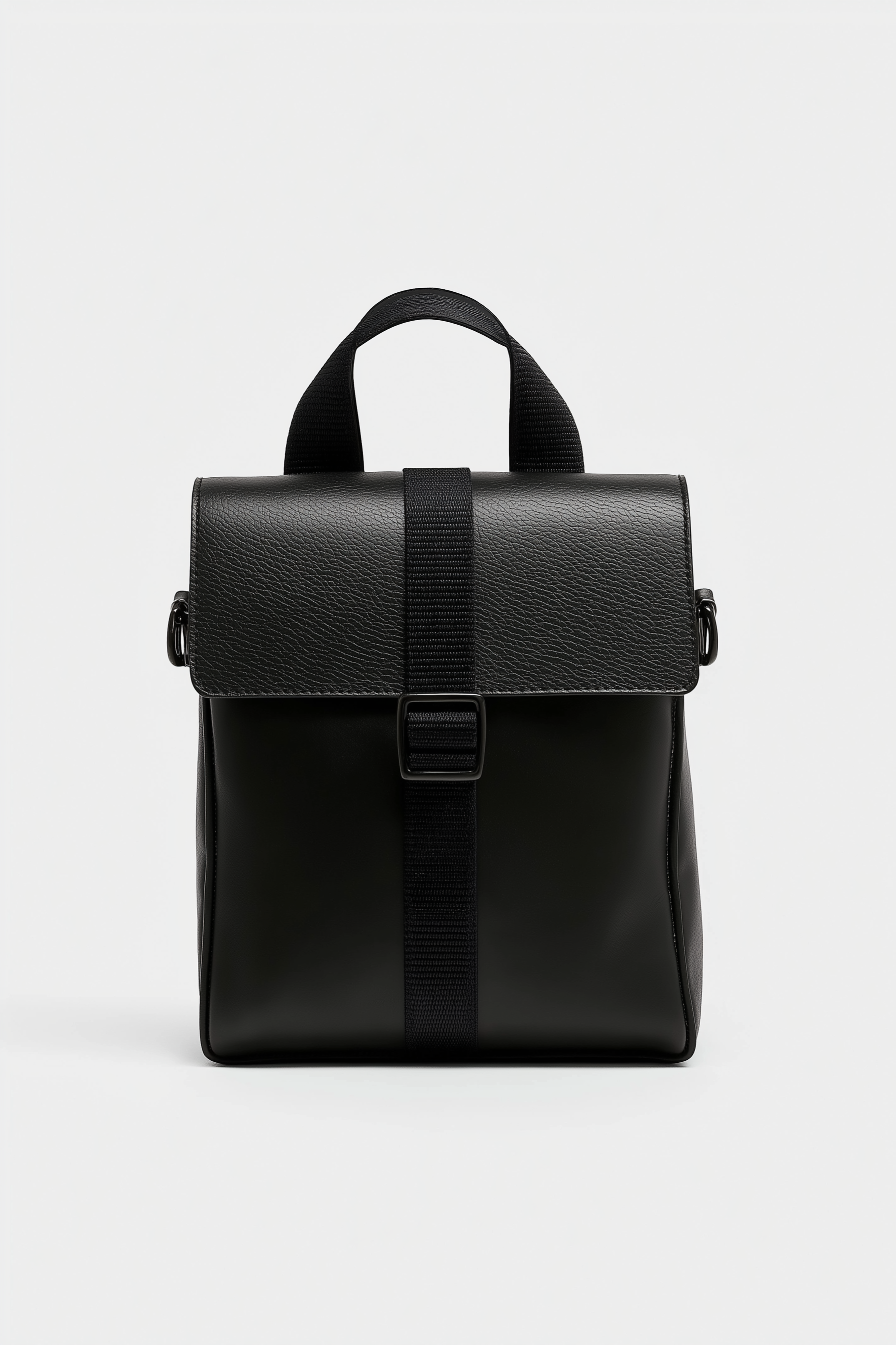 Minimalist Black Backpack with Textured Flap Closure