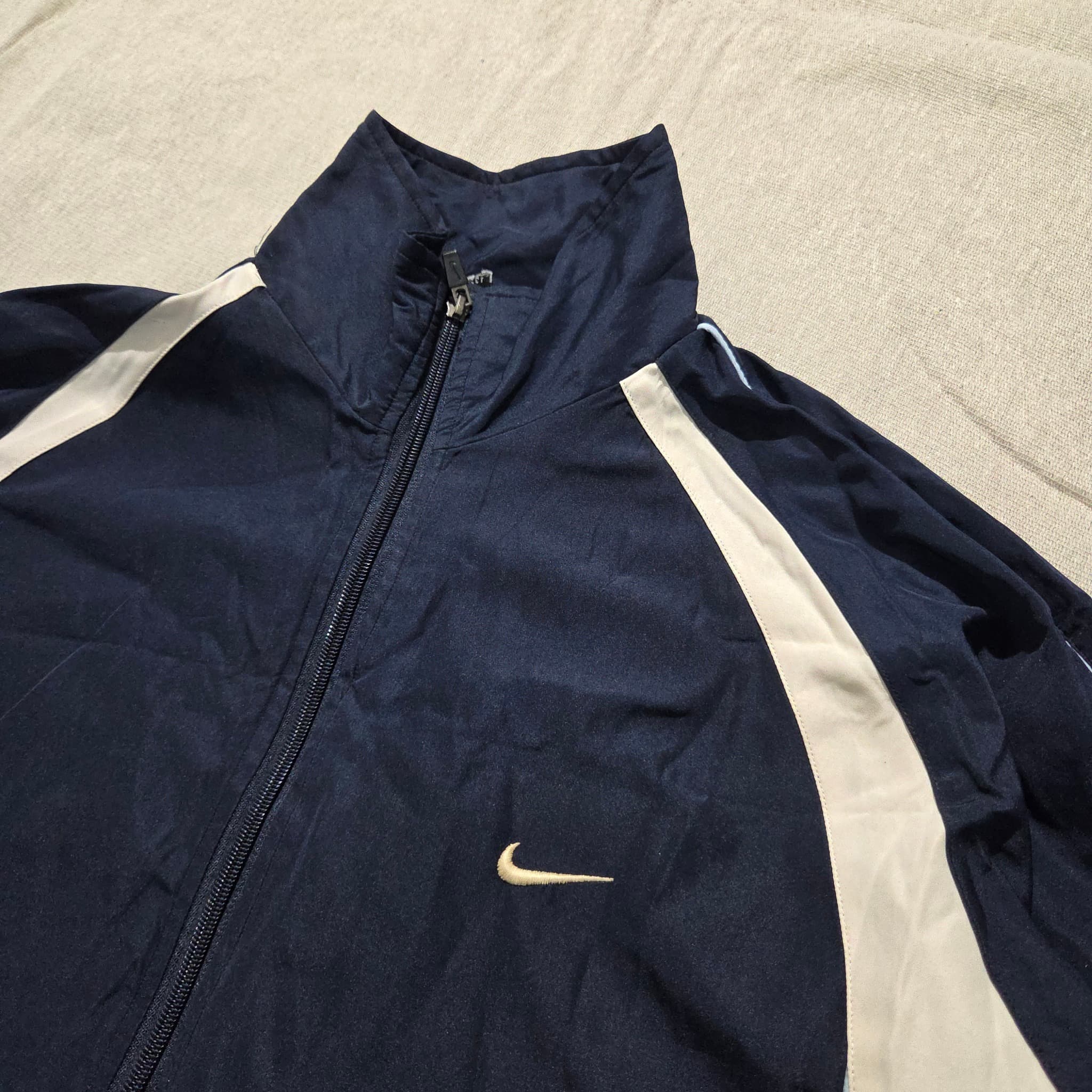 Vintage Nike Navy Blue and White Track Jacket Full Zip Baggy 2000s Release — photo 2 of 5